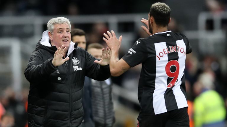 Newcastle United's Joelinton celebrates scoring his side's fourth goal of the game with manager Steve Bruce during the FA Cup third round replay match at St James' Park