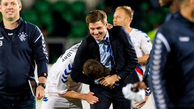 Steven Gerrard celebrates with Andy Halliday at full time against Ufa