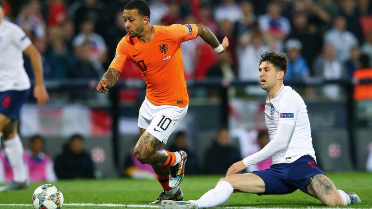 GUIMARAES, PORTUGAL - JUNE 06:  John Stones of England is dispossessed by Memphis Depay of Netherlands leading to the second goal for the Netherlands during the UEFA Nations League Semi-Final match between the Netherlands and England at Estadio D. Afonso Henriques on June 6, 2019 in Guimaraes, Portugal. (Photo by Craig Mercer/MB Media/Getty Images)