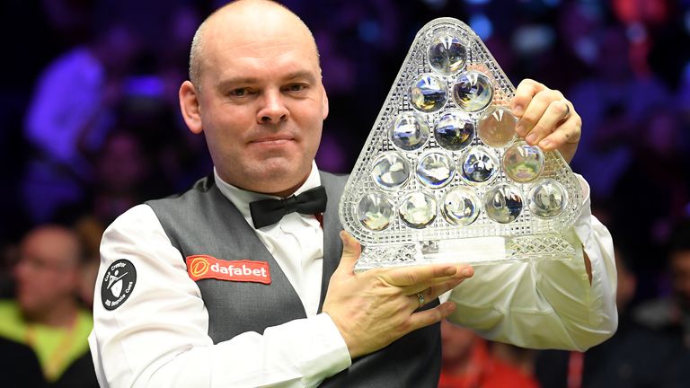 Stuart Bingham poses for a photo with the Paul Hunter Trophy after victory in the Final of the Dafabet Masters between Stuart Bingham and Ali Carter at Alexandra Palace on January 19, 2020 in London, England.