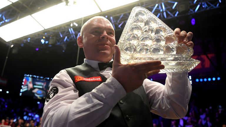 Stuart Bingham poses for a photo with the Paul Hunter Trophy after victory in the Final of the Dafabet Masters between Stuart Bingham and Ali Carter at Alexandra Palace on January 19, 2020 in London, England