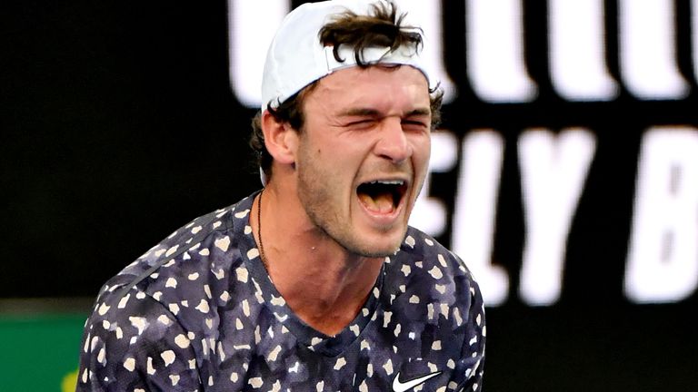 Tommy Paul of the US celebrates victory against Bulgaria's Grigor Dimitrov during their men's singles match on day three of the Australian Open tennis tournament in Melbourne on January 22, 2020.