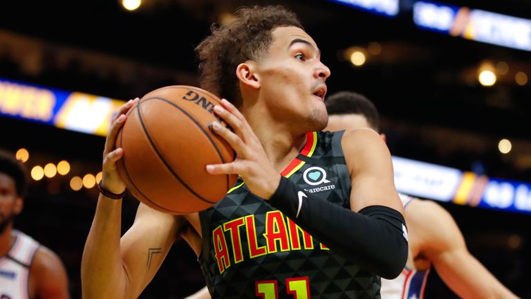 Trae Young looks to pass out of pressure from the Philadelphia 76ers