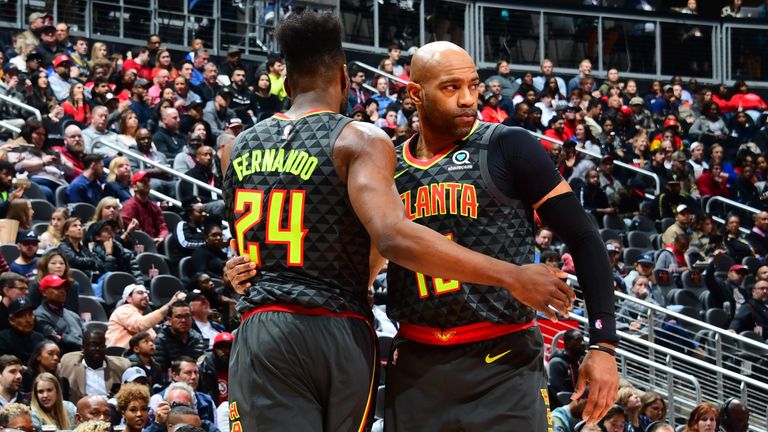 Vince Carter of the Atlanta Hawks hugs Bruno Fernando during the game against the Indiana Pacers