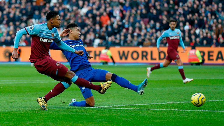 Sebastien Haller fires a shot during the first half at Jordan Pickford's legs