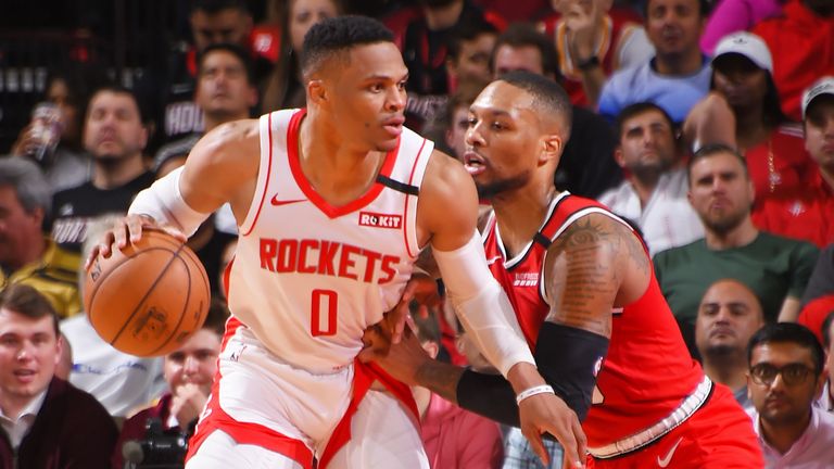 Russell Westbrook #0 of the Houston Rockets handles the ball against Damian Lillard #0 of the Portland Trail Blazers