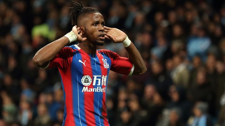 Wilfried Zaha cups his ears after Crystal Palace's late equaliser at the Etihad Stadium