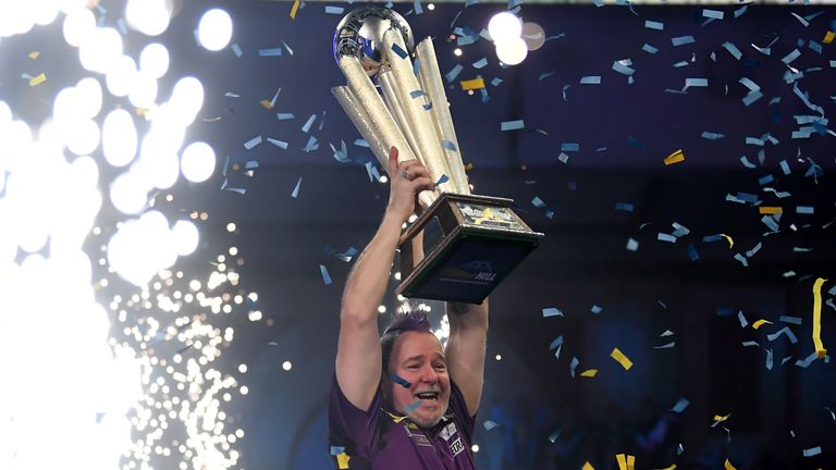 Peter Wright lifts the Sid Waddell William Hill World Darts Championship Trophy after victory in the Final of the 2020 William Hill World Darts Championship between Peter Wright and Michael van Gerwen at Alexandra Palace on December 31, 2019 in London, England. 