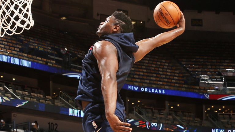 Zion Williamson throws down a dunk during Pelicans practice
