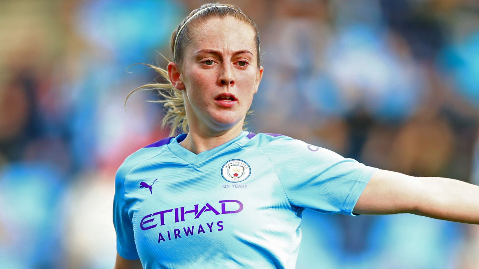  Kiera Walsh in a blue Manchester City shirt playing soccer during a match.