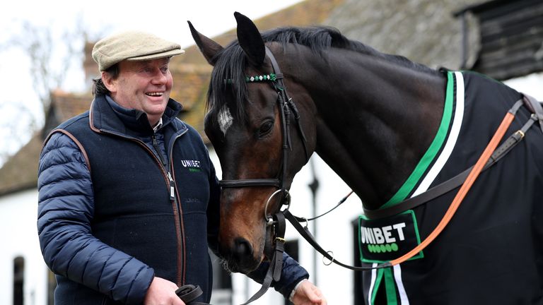 Trainer Nicky Henderson poses for a photo with Altior 