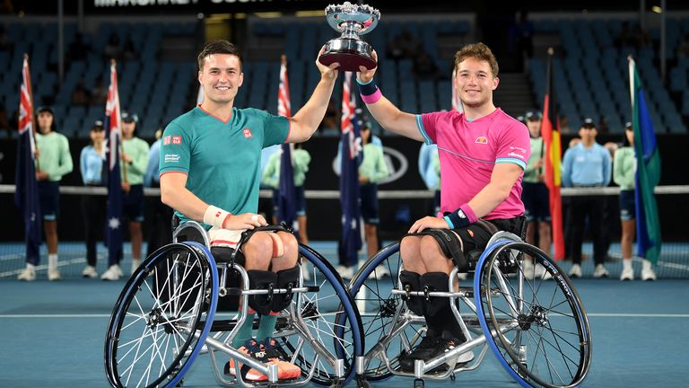Alfie Hewitt and Gordon Reid of Great Britain pose with the championship trophy after winning their Men's Wheelchair Doubles Final match against Stephane Houdet and Nicolas Peifer of France on day twelve of the 2020 Australian Open at Melbourne Park on January 31, 2020 in Melbourne, Australia