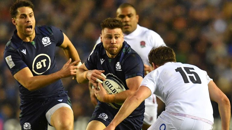 Scotland scrum-half Ali Price runs at England full-back George Furbank