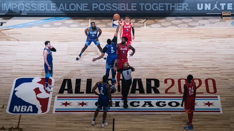 Joel Embiid of Team Giannis and Anthony Davis of Team LeBron reaches for the ball during the 69th NBA All-Star Game