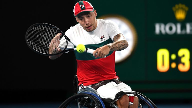 Britains's Andy Lapthorne hits a return against Australia's Dylan Alcott during their men's quad wheelchair singles final on day thirteen of the Australian Open tennis tournament in Melbourne on February 1, 2020. 