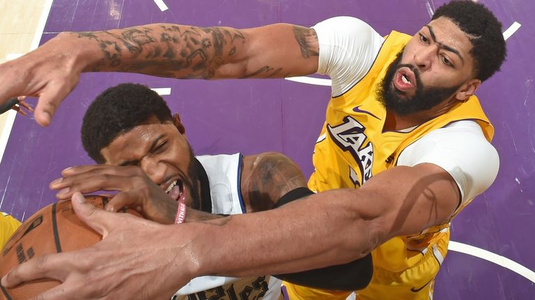 Anthony Davis blocks Paul George at the rim