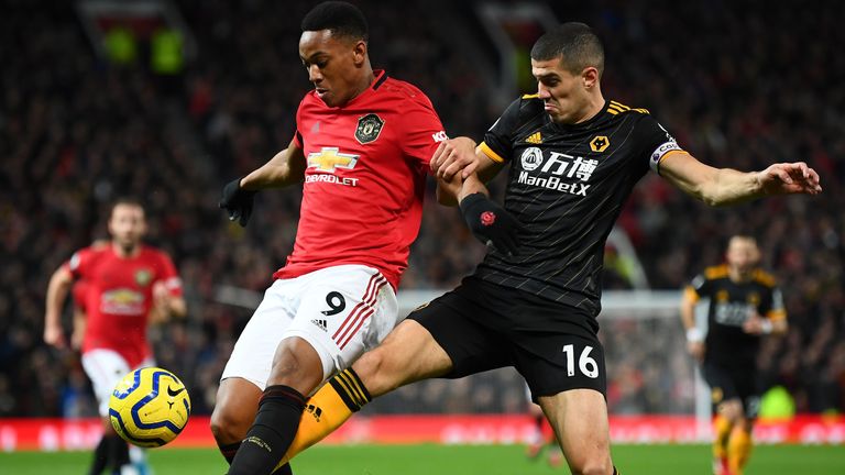 Anthony Martial is challenged by Conor Coady