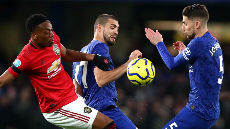 LONDON, ENGLAND - FEBRUARY 17: Anthony Martial of Manchester United and Mateo Kovacic and Jorginho of Chelsea FC in action during the Premier League match between Chelsea FC and Manchester United at Stamford Bridge on February 17, 2020 in London, United Kingdom. (Photo by Chloe Knott - Danehouse/Getty Images)