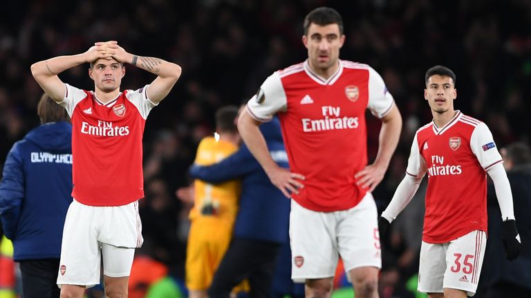 Arsenal players react after losing to Olympiakos
