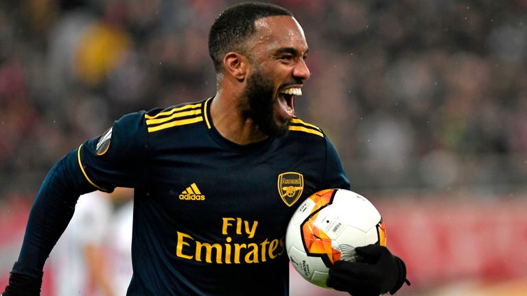 Alexandre Lacazette celebrates his goal against Olympiakos