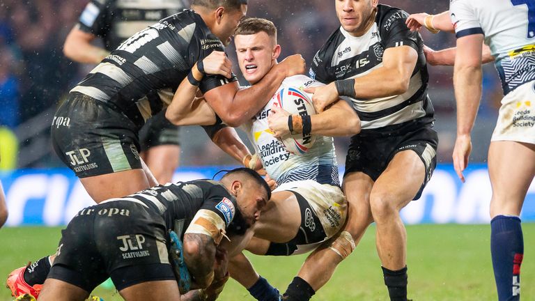 Ash Handley is tackled by Carlos Tuimavave and Manu Ma'u