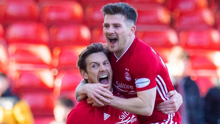 Ash Taylor celebrates scoring for Aberdeen against Celtic