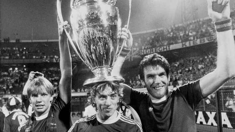 Aston Villa's Gary Shaw (left), Tony Morley (centre) and scorer of the winning goal Peter Withe (right) proudly show off the cup to the Villa fans in the Feyenoord Stadion. Villa beat Bayern Munich 0-1.