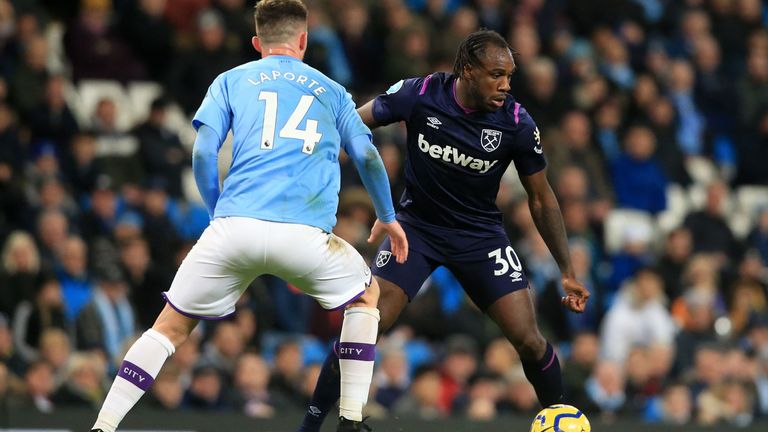 West Ham's Michail Antonio takes on Manchester City's Aymeric Laporte during the game at the Etihad Stadium