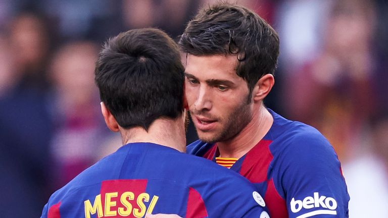 Sergi Roberto is congratulated by Lionel Messi are doubling Barcelona's lead
