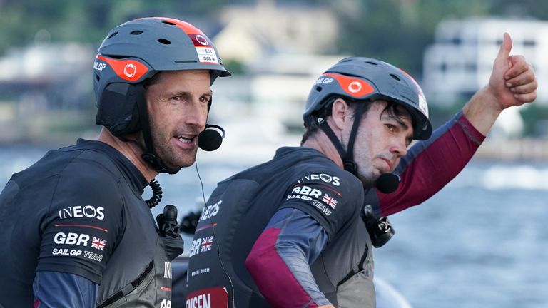 Ben Ainslie, helmsman, and Iain Jensen, wing trimmer, celebrate winning the final match race and SailGP Sydney on Race Day 2