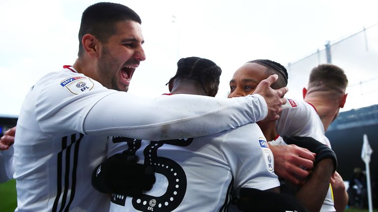 Bobby Reid celebrates with his team-mates after scoring his sides first goal during the Sky Bet Championship match between Fulham and Huddersfield Town at Craven Cottage