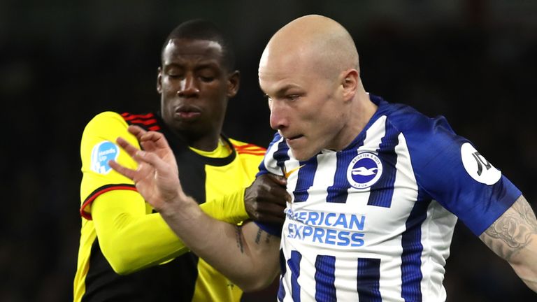 Aaron Mooy and Abdoulaye Doucoure battle for the ball