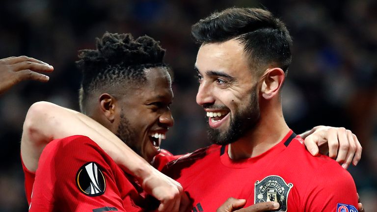Manchester United's Bruno Fernandes (right) celebrates scoring his side's first goal with Fred