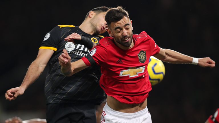 Bruno Fernandes and Raul Jimenez in Premier League action at Old Trafford