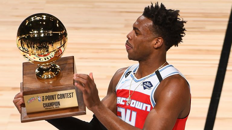 Buddy Hield lifts the trophy after winning the 3-Point Contest at All-Star Saturday Night