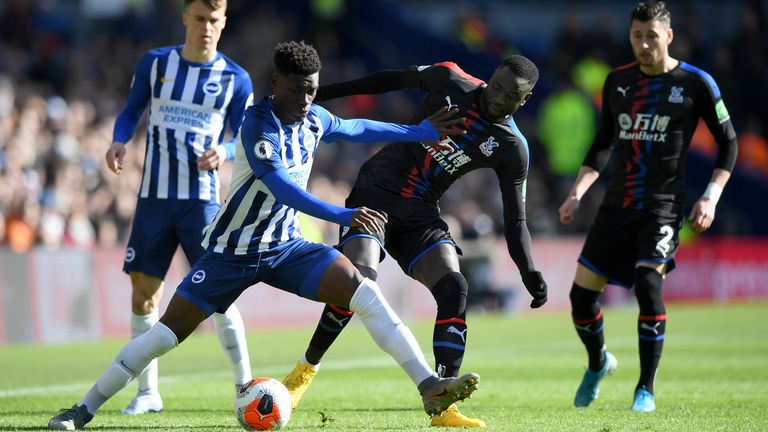 Cheikhou Kouyate and Yves Bissouma compete for possession