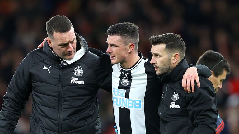 Ciaran Clark is helped off at Arsenal after injuring his ankle