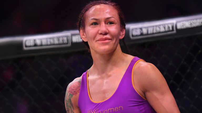 Cris Cyborg (blue gloves) in the cage after defeating Julia Budd (not pictured) in their featherweight world title fight at The Forum on January 25, 2020 in Inglewood, California. Cyborg won by TKO in the 4th round