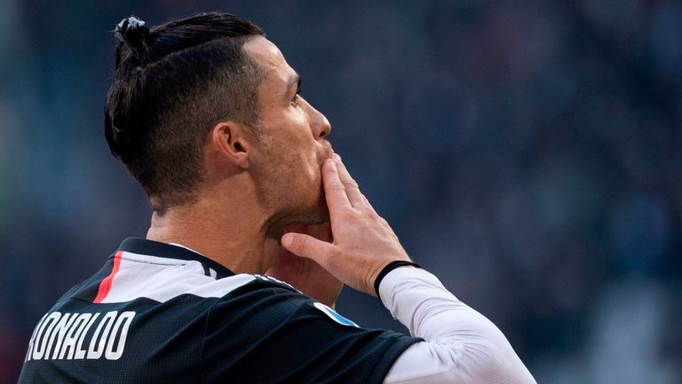 Cristiano Ronaldo gestures to the crowd in Turin after reaching another milestone