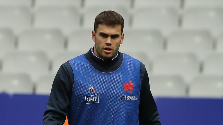 France wing Damian Penaud, with his left leg heavy strapped, looks on during the Captain's run at the Stade de France ahead of their Six Nations game with England