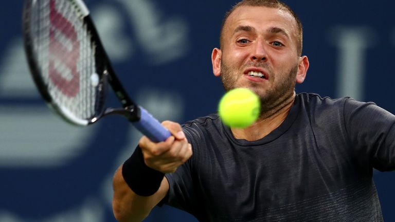 Dan Evans of Great Britain plays a forehand against Fabio Fognini of Italy during his men's singles match on Day Nine of the Dubai Duty Free Tennis at Dubai Duty Free Tennis Stadium on February 25, 2020 in Dubai, United Arab Emirates.