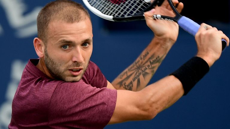 Dan Evans of Britain returns the ball to Russia&#39;s Andrey Rublev during the quarter-finals of the Dubai Duty Free Tennis Championship in the Gulf emirate of Dubai on February 27, 2020