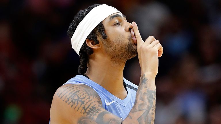 D'Angelo Russell gestures for the Miami Heat home fans to be quiet