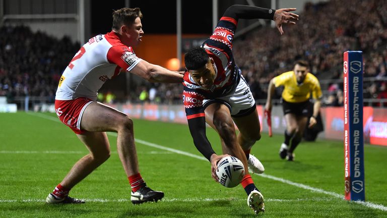 Daniel Tupou of Sydney Roosters scores his sides first try as he is challenged by Jack Welsby of St Helens R.F.C during the World Club Series Final between St Helens at Totally Wicked Stadium on February 22, 2020 in St Helens, England. 