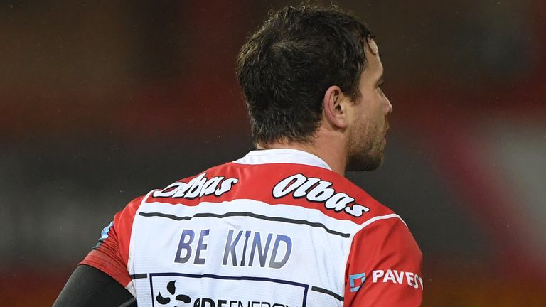Danny Cipriani of Gloucester in action with the 'Be Kind' message on the back of the shirt