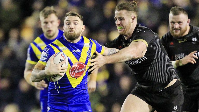 Warrington's Daryl Clark tackled by Toronto's Anthony Mullally