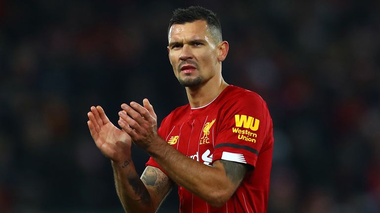 Dejan Lovren of Liverpool applauds the supporters following the Premier League match between Liverpool FC and Brighton & Hove Albion at Anfield on November 30, 2019 in Liverpool, United Kingdom.