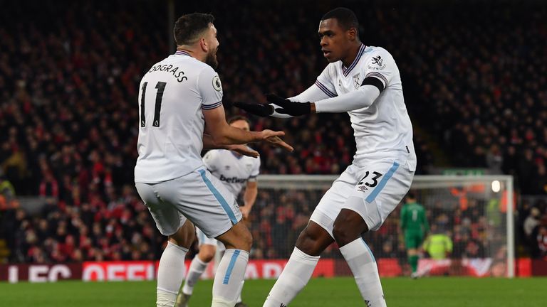 West Ham's Robert Snodgrass and Issa Diop celebrate their equaliser against Liverpool.