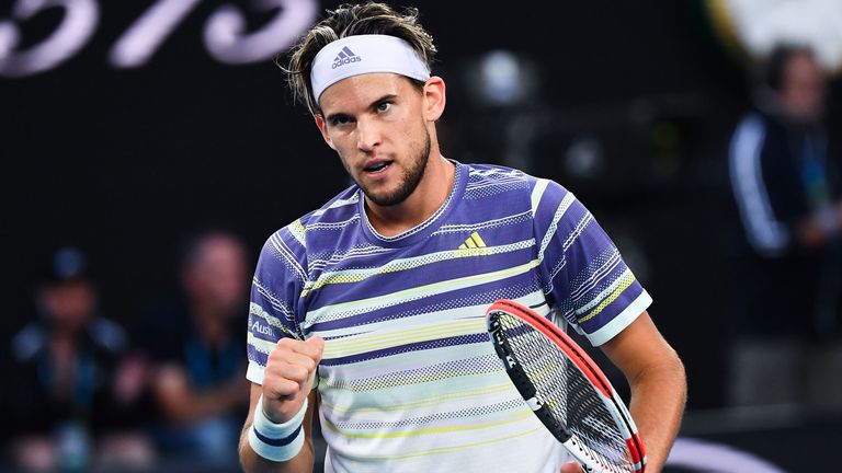 Austria's Dominic Thiem reacts after a point against Serbia's Novak Djokovic during their men's singles final match on day fourteen of the Australian Open tennis tournament in Melbourne on February 2, 2020