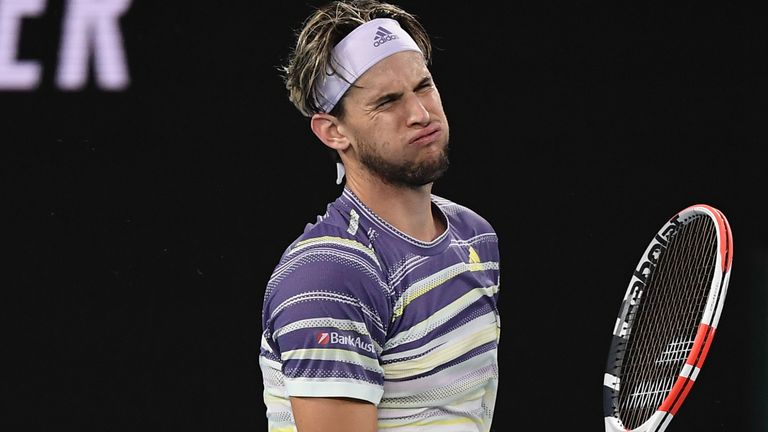 Austria's Dominic Thiem reacts as he plays against Serbia's Novak Djokovic during their men's singles final match on day fourteen of the Australian Open tennis tournament in Melbourne on February 2, 2020